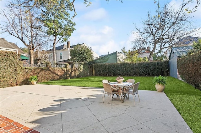 view of patio / terrace featuring outdoor dining space and a fenced backyard