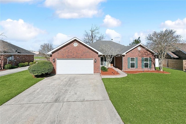 ranch-style house with fence, driveway, an attached garage, a front lawn, and brick siding