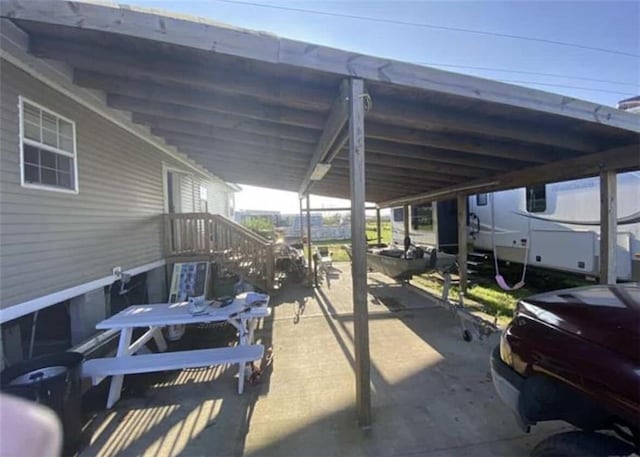 view of patio / terrace with a carport