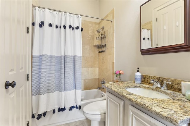 full bathroom with vanity, shower / tub combo, and toilet