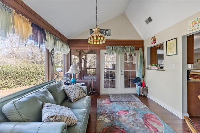 sunroom / solarium with lofted ceiling, french doors, and visible vents