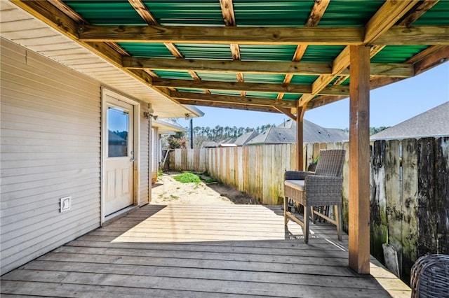 deck with a fenced backyard