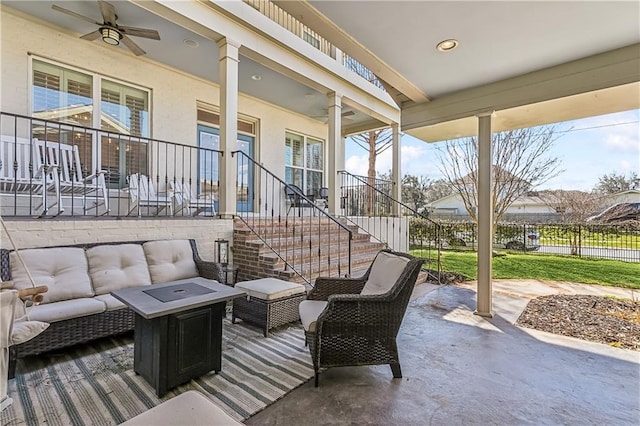 view of patio / terrace with stairway, an outdoor living space, and ceiling fan