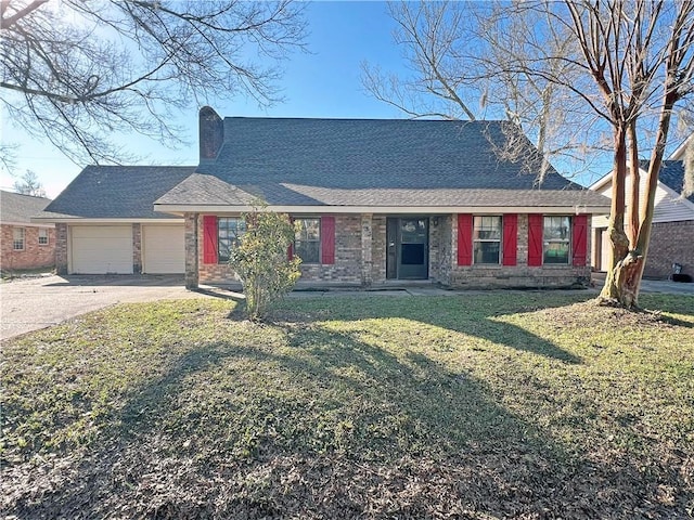 view of front of house with a front yard, driveway, a shingled roof, a chimney, and a garage