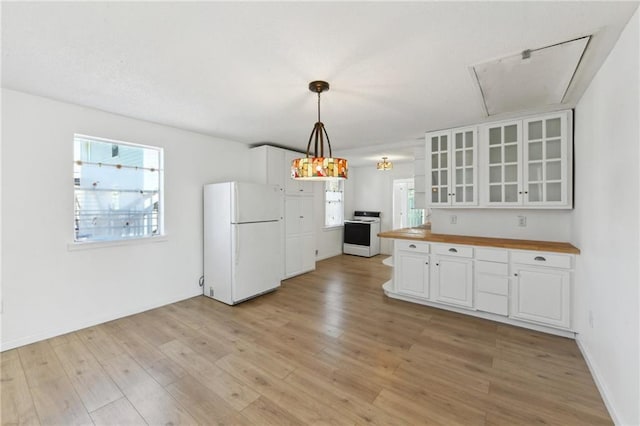 kitchen with light wood-type flooring, glass insert cabinets, white appliances, and white cabinets