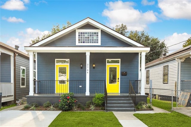 2764 Lavender St, New Orleans, LA 70122 - view of front of home with a porch and a front yard