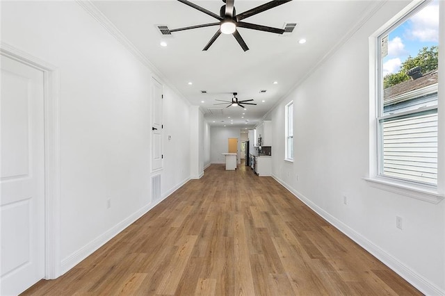 2764 Lavender St, New Orleans, LA 70122 - hall with crown molding, light wood-style flooring, baseboards, and recessed lighting