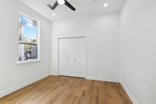 2764 Lavender St, New Orleans, LA 70122 - unfurnished bedroom with light wood-style flooring, baseboards, recessed lighting, a ceiling fan, and a closet