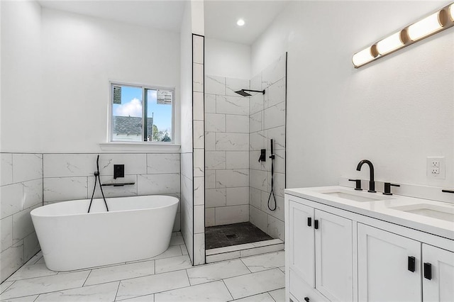 2764 Lavender St, New Orleans, LA 70122 - full bathroom with marble finish flooring, tiled shower, a soaking tub, double vanity, and recessed lighting