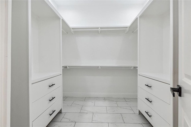 2764 Lavender St, New Orleans, LA 70122 - walk in closet featuring light marble finish flooring