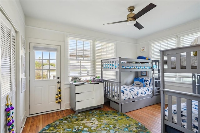 bedroom featuring a ceiling fan and wood finished floors