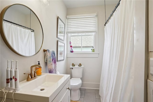 full bath featuring a shower with curtain, toilet, tile patterned flooring, baseboards, and vanity