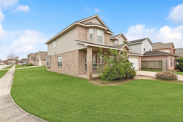 view of home's exterior featuring brick siding, a lawn, and fence