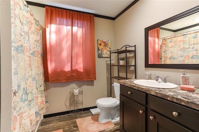 bathroom featuring crown molding, wood finished floors, vanity, curtained shower, and toilet