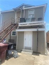 view of front of house featuring a balcony