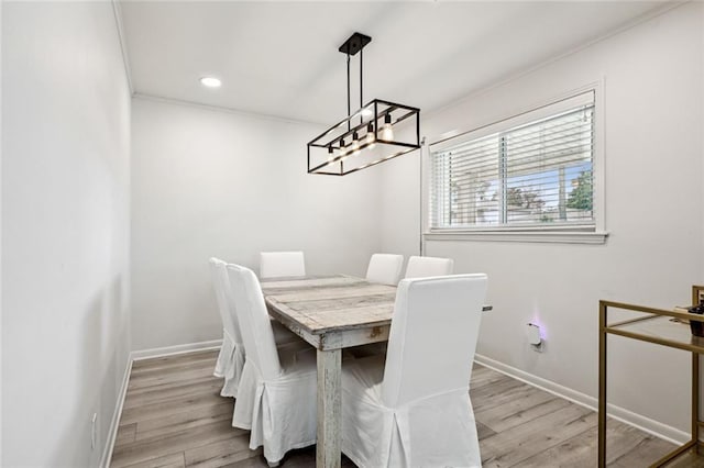 dining area with recessed lighting, baseboards, and wood finished floors