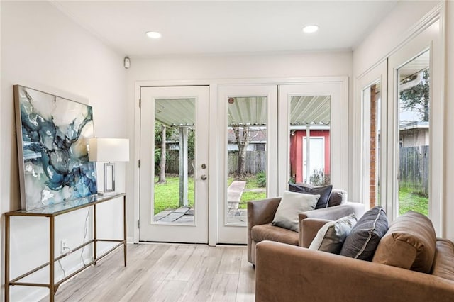 entryway with a wealth of natural light, light wood-style floors, and recessed lighting