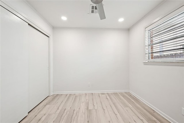 unfurnished bedroom featuring baseboards, recessed lighting, ceiling fan, light wood-style floors, and a closet