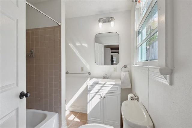 full bathroom featuring toilet, vanity, and washtub / shower combination