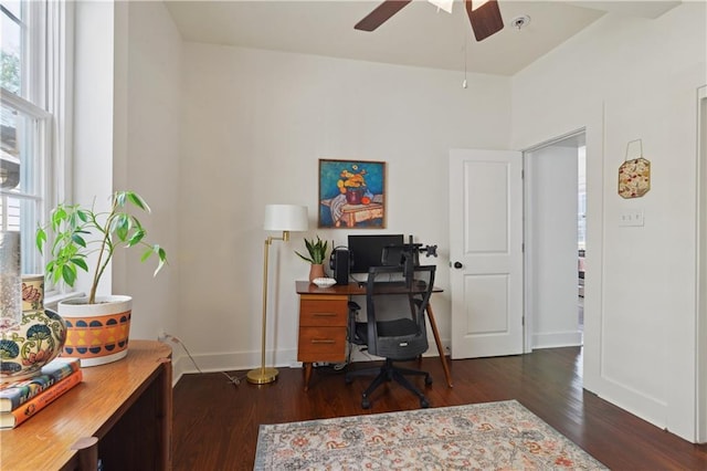 office with dark wood-type flooring, baseboards, and ceiling fan