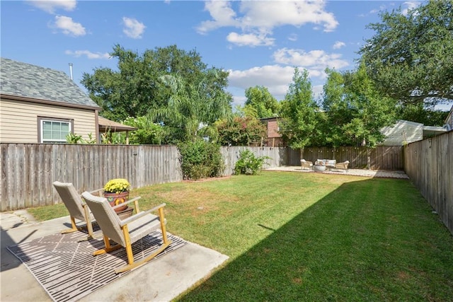 view of yard with a patio and a fenced backyard