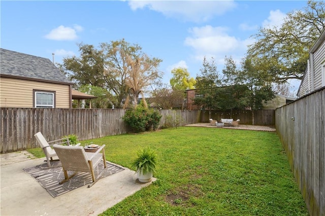 view of yard with a fenced backyard and a patio