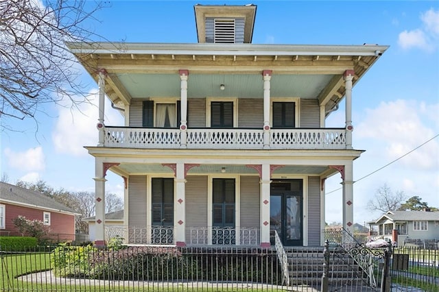 view of front of house with a fenced front yard and covered porch