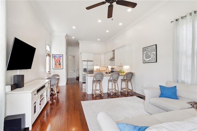 8428 Willow St, New Orleans, LA 70118 - living room with ornamental molding, a ceiling fan, dark wood finished floors, and recessed lighting