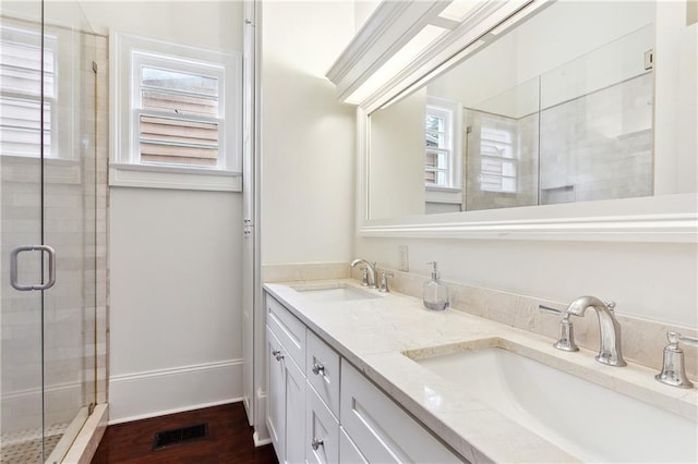 8428 Willow St, New Orleans, LA 70118 - bathroom with a shower stall and double vanity