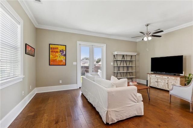 living room with dark wood-style floors, french doors, crown molding, and baseboards