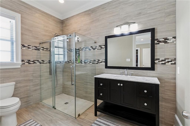 full bath featuring toilet, tile walls, a shower stall, and crown molding