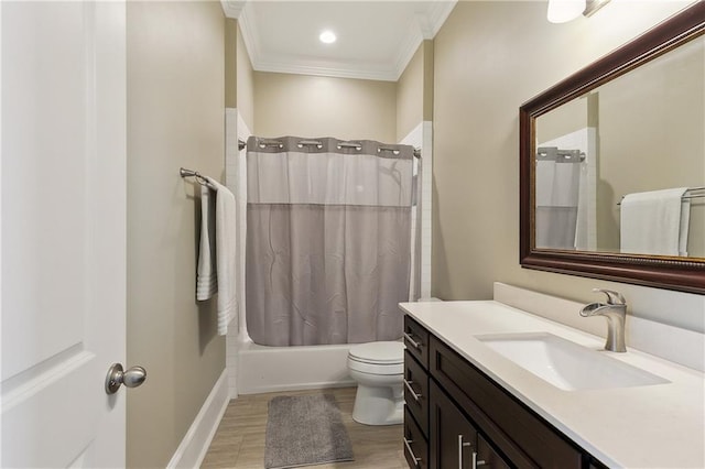 bathroom with vanity, wood finished floors, crown molding, toilet, and shower / tub combo with curtain