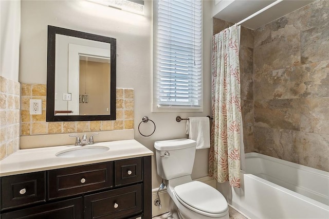 full bath featuring vanity, shower / tub combo, and toilet