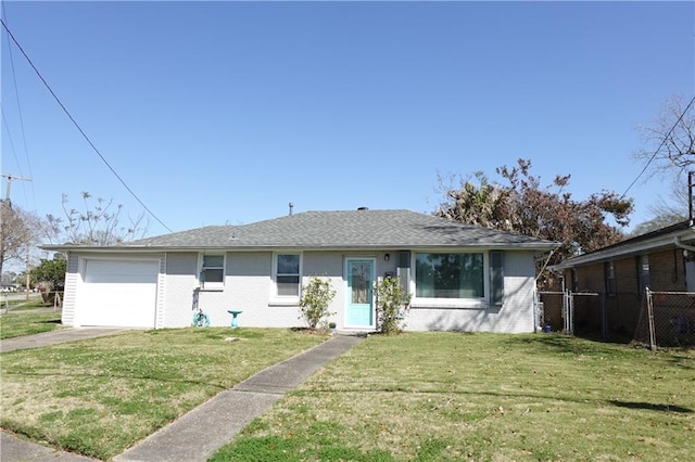 ranch-style house with a front lawn, an attached garage, and brick siding