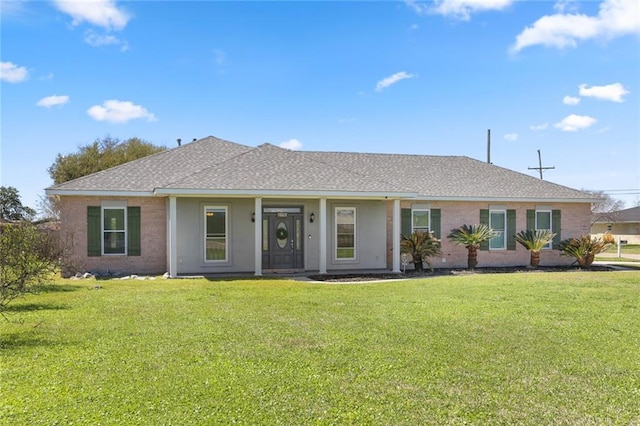 single story home with a front lawn and roof with shingles