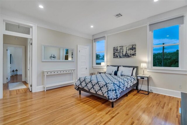 926 City Park Ave, New Orleans, LA 70119 - bedroom featuring light wood-type flooring, visible vents, recessed lighting, crown molding, and baseboards