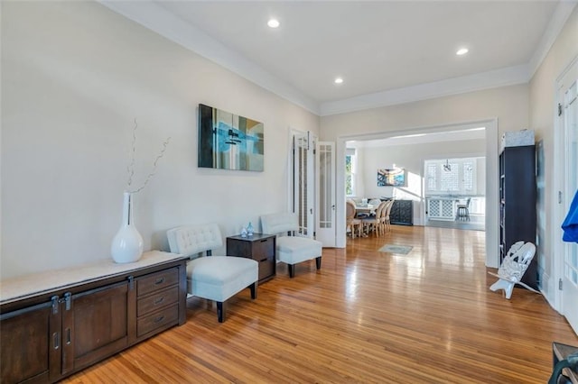 926 City Park Ave, New Orleans, LA 70119 - sitting room with recessed lighting, light wood-style flooring, and ornamental molding