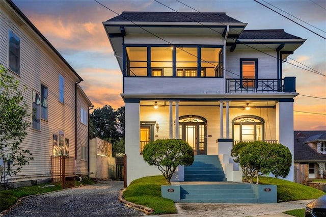 926 City Park Ave, New Orleans, LA 70119 - view of front of house with covered porch, a balcony, and roof with shingles