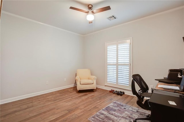 office featuring visible vents, wood finished floors, and ornamental molding