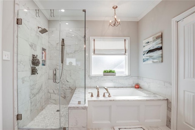 bathroom with a bath, a chandelier, a marble finish shower, and ornamental molding