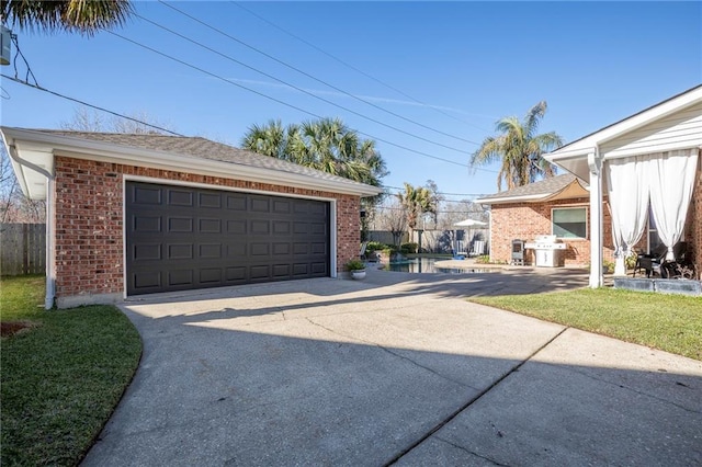 detached garage featuring fence