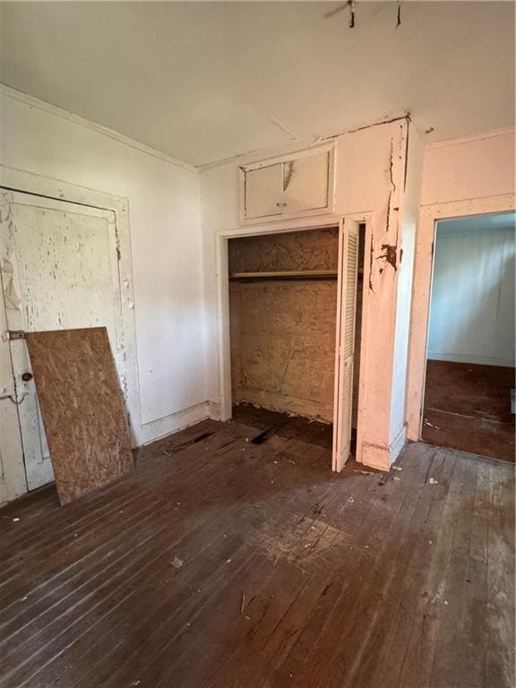 interior space with hardwood / wood-style flooring and a closet