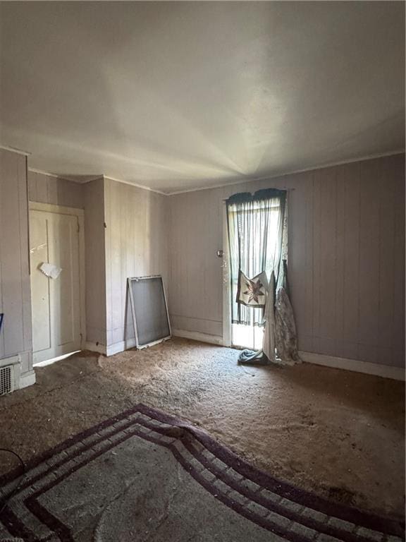 unfurnished living room with visible vents