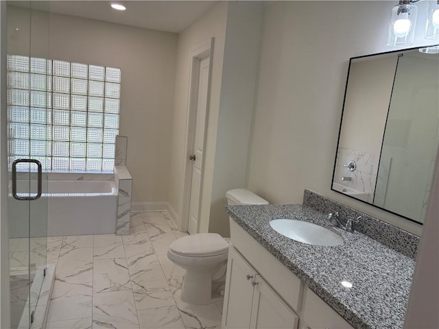 full bath featuring a garden tub, marble finish floor, toilet, recessed lighting, and vanity