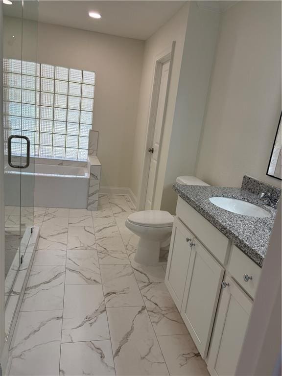 full bath featuring a shower stall, toilet, a garden tub, marble finish floor, and vanity