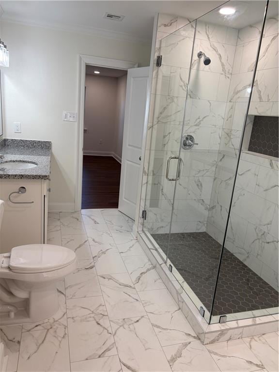 bathroom featuring a marble finish shower, visible vents, baseboards, ornamental molding, and vanity