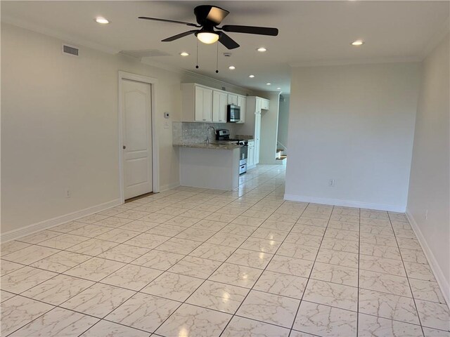 interior space with visible vents, crown molding, baseboards, marble finish floor, and a ceiling fan