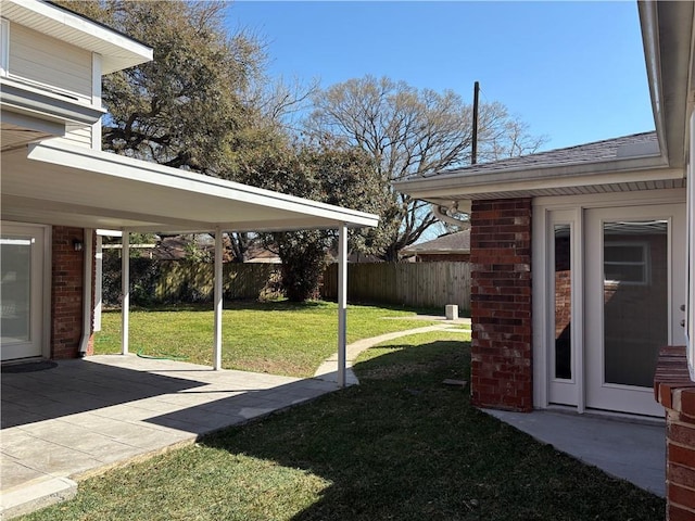 view of yard with a patio area and fence