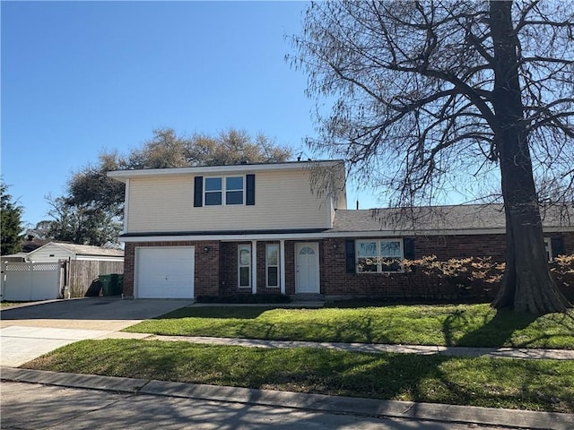 traditional home featuring brick siding, concrete driveway, a front yard, and fence