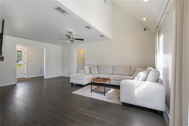 living area featuring dark wood finished floors, visible vents, lofted ceiling, and ceiling fan